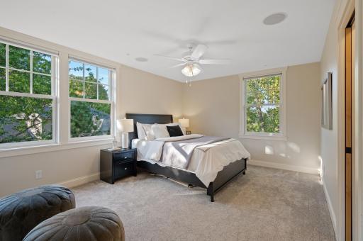 Each of the three additional upper-level bedrooms boasts its own walk-in closet.