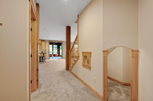 A cozy, finished under stairs nook offers the perfect play area or reading corner, tucked away for a sense of privacy and imagination.
