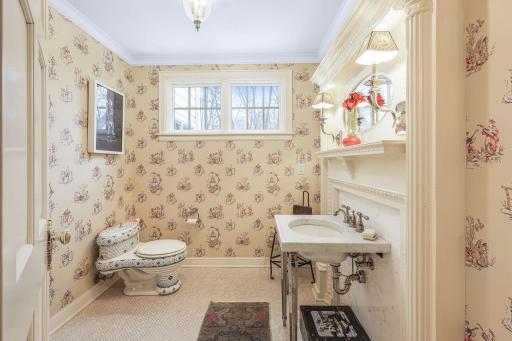 The main level powder room is spacious and a perfect guest bath.