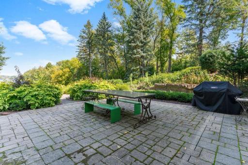 The patio walks into the backyard garden paths.