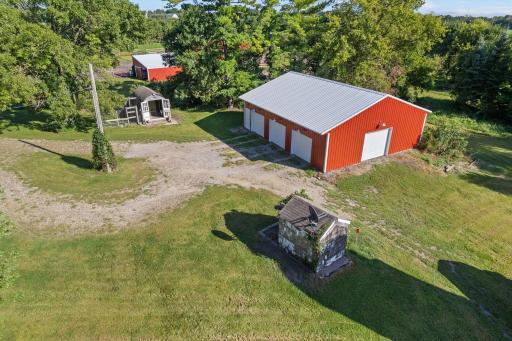 40x36 pole shed with room for 3 cars and additional equipment. Electric car charging station too!