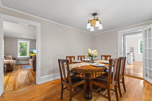 Living room and kitchen are accessible from the dining room