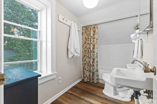 Upper level full bath with new flooring and resurface tub