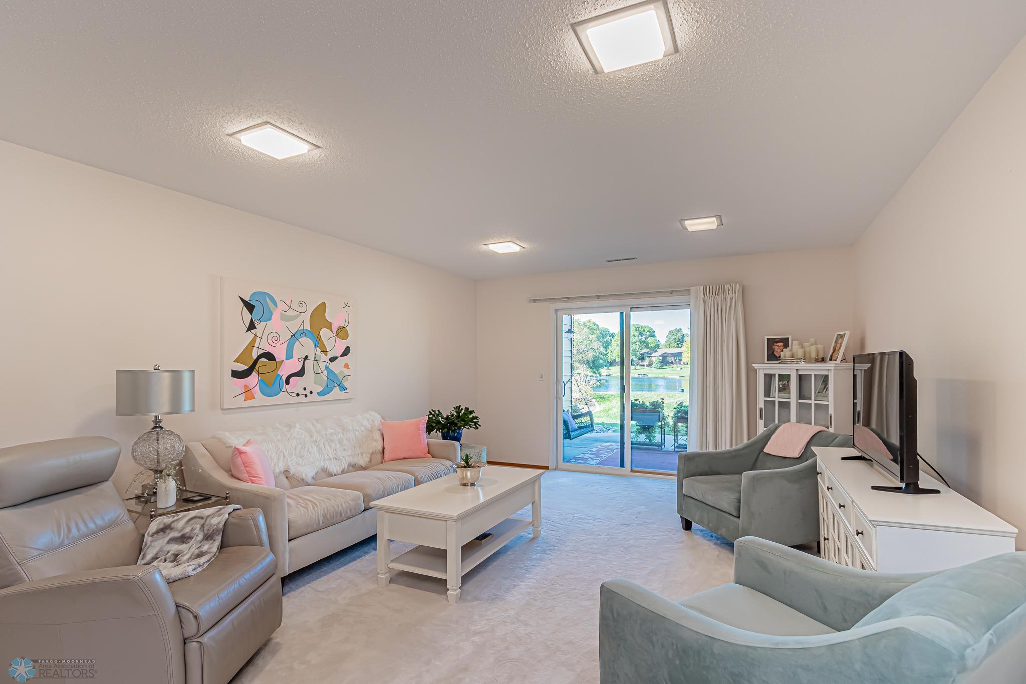 Walk out level family room - door to patio overlooking Bluemont Lake