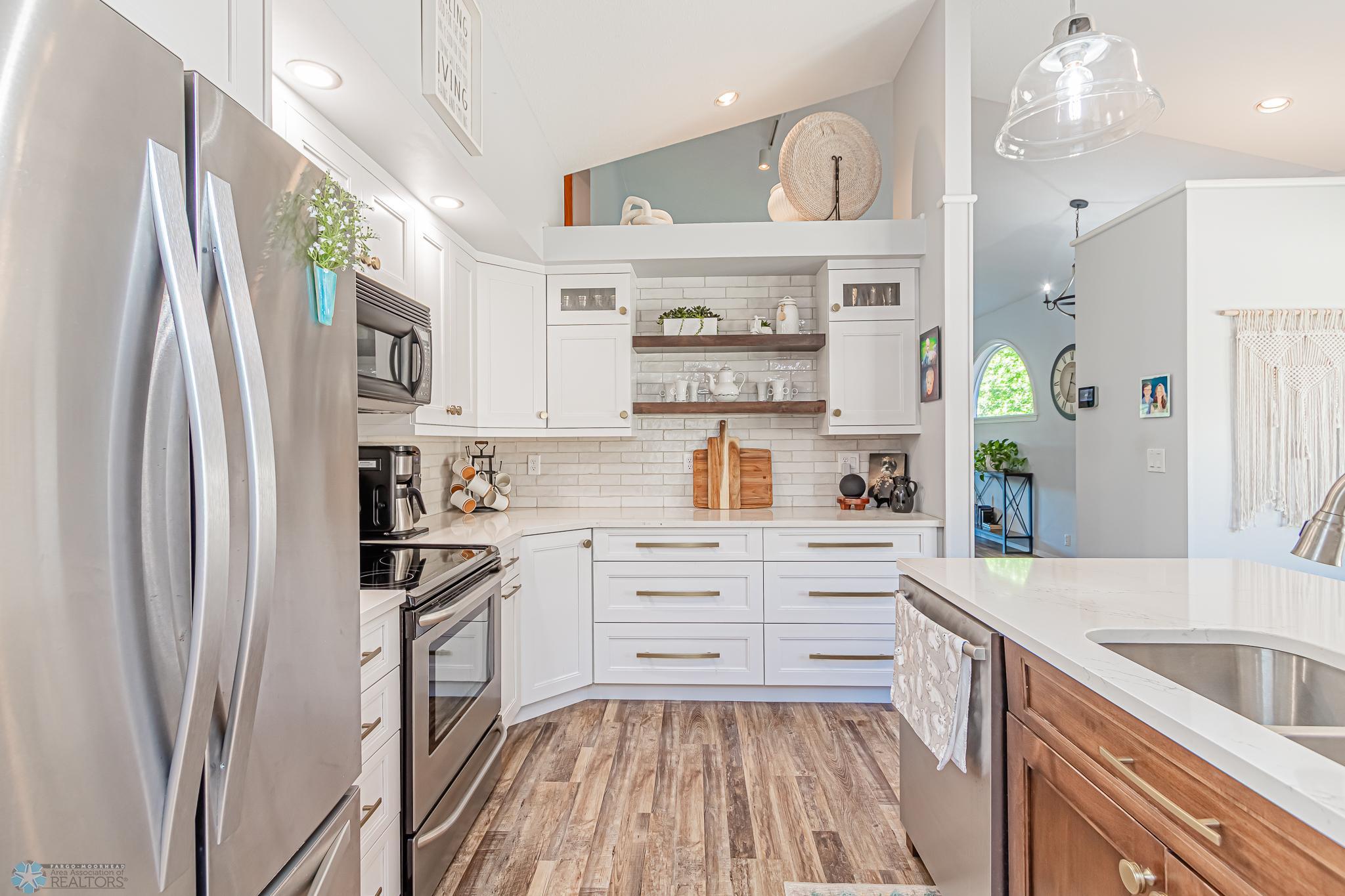 Quartz counters and tile backsplash
