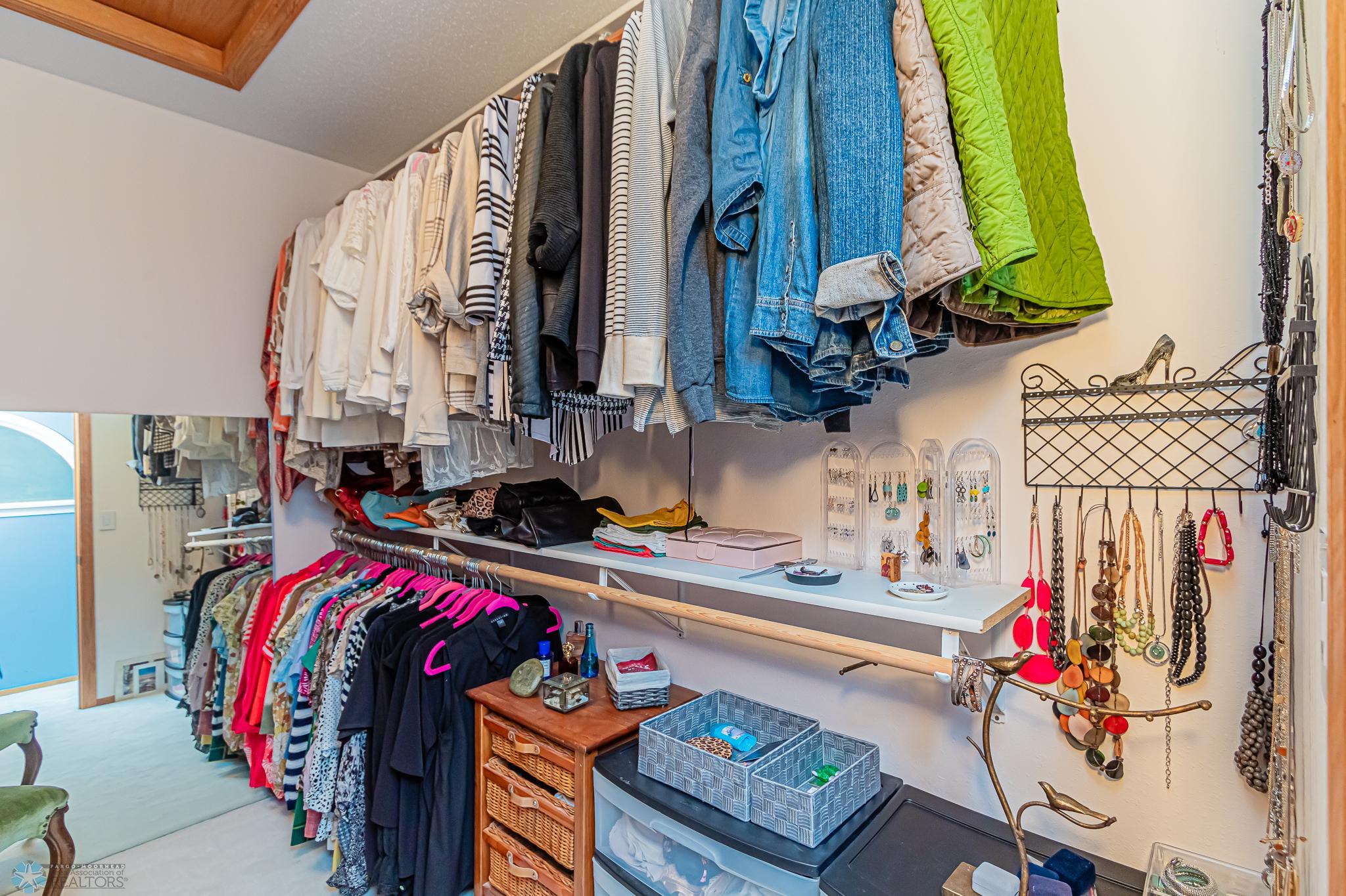 Lots of hanging space in primary walk-in closet
