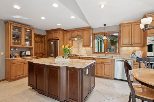The walk-in pantry includes custom shelving, a freezer and a wine refrigerator.