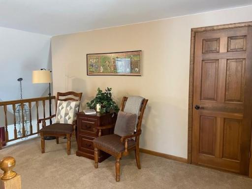 With a bit of vision and renovation, you can transform the loft and unfinished dormer into an additional upper level bedroom. Open this door to view an ideal space for a nursery or cozy guest room.
