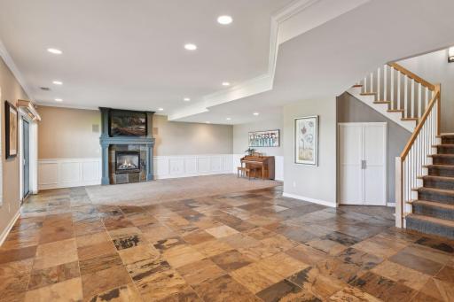 Another cozy gas fireplace is found on this level