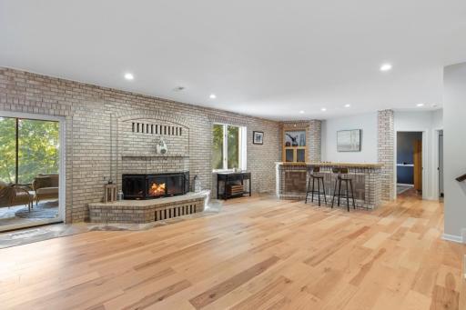 Lower Level Family Room with Wood Burning Fireplace and Bar