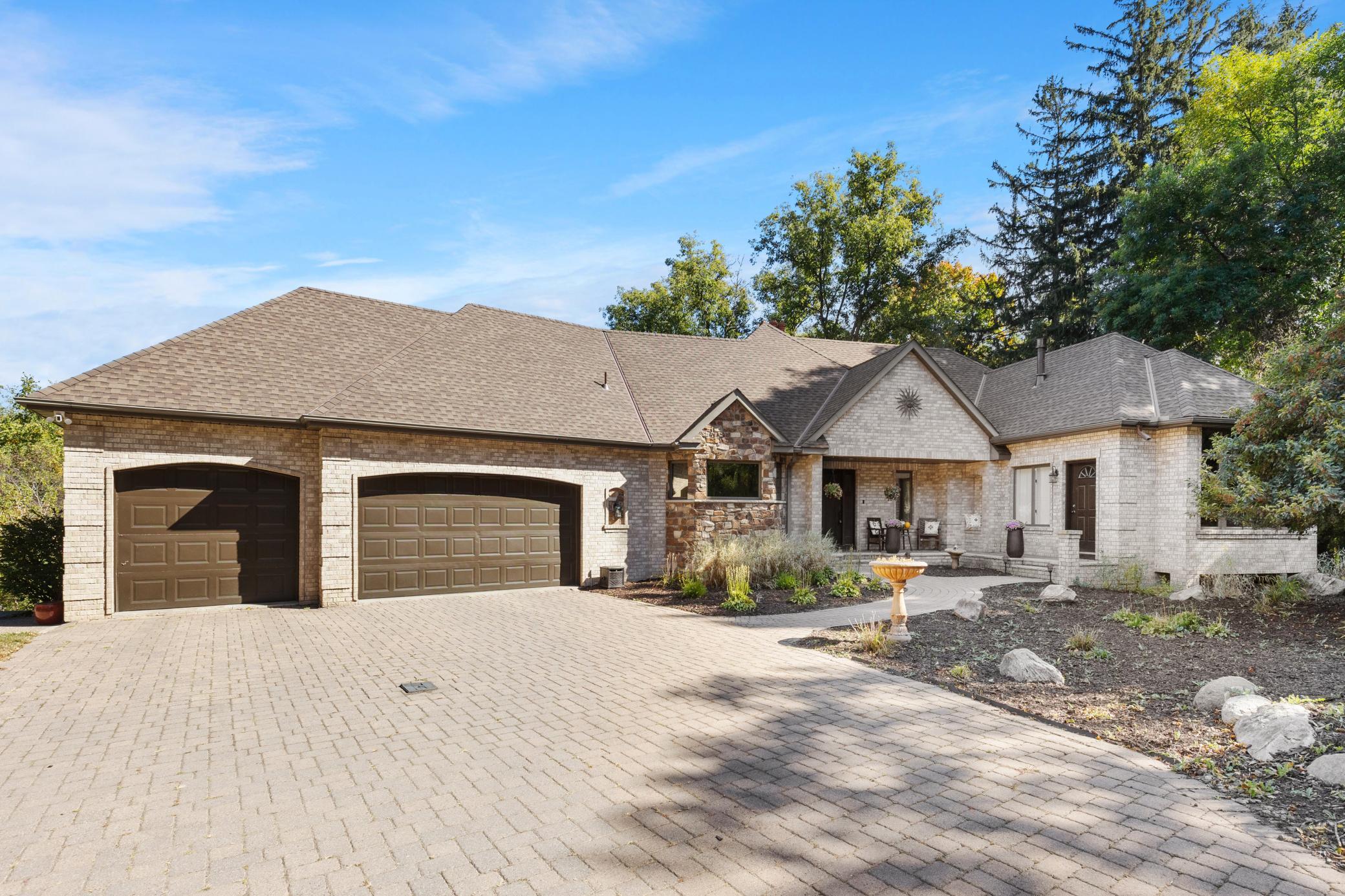 A large Paver Driveway leads up to the Grand Entrance