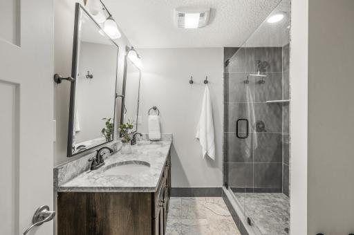 3/4 Private Bathroom for Lower Level Bedroom. Includes Dual Sinks and Walk-In Shower