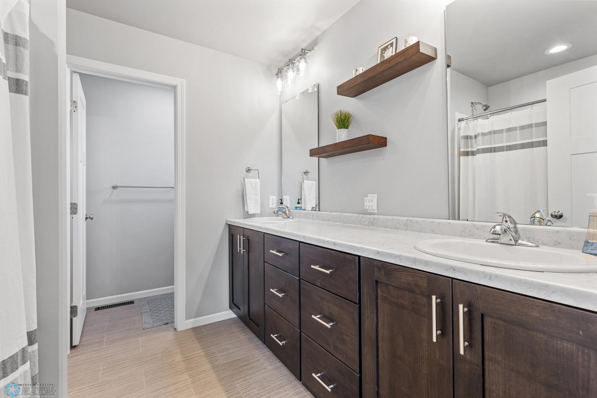 Primary Bathroom- Double Sinks & Toilet Room