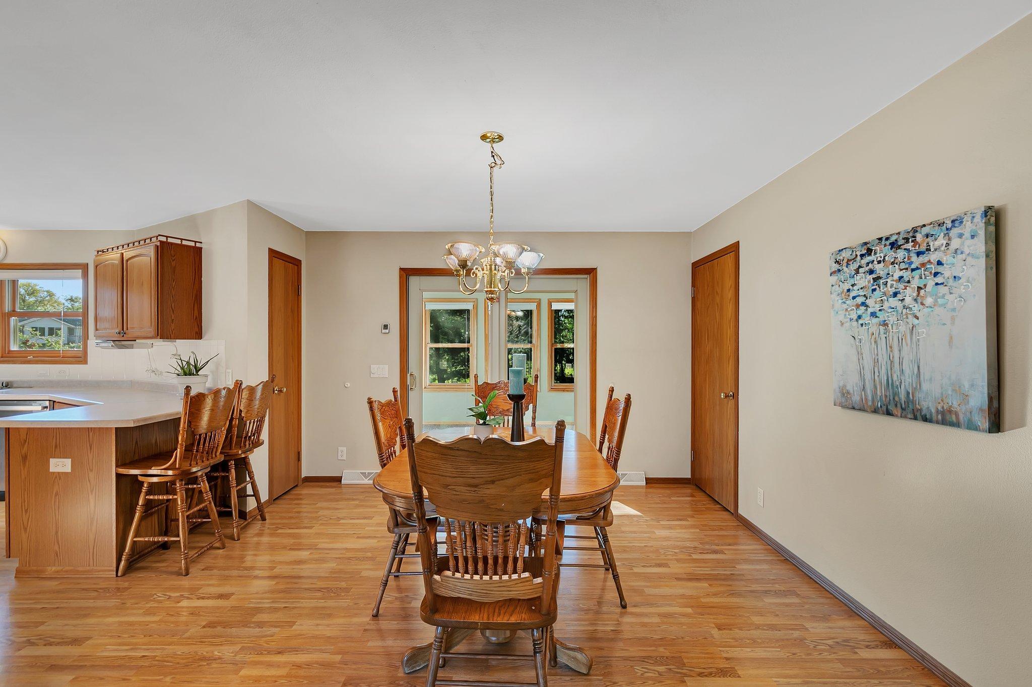 Dining Room with door to four season porch.