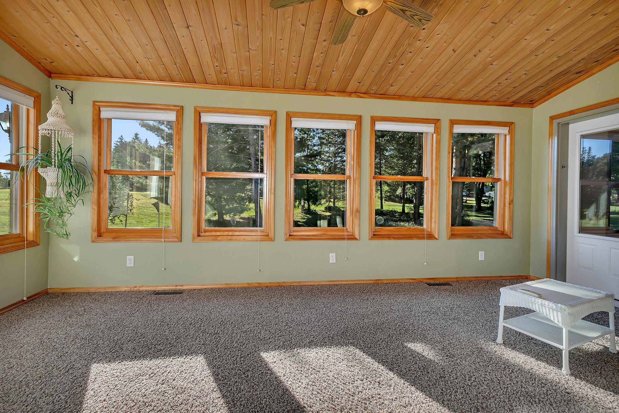 Four season porch overlooks the back yard.