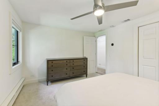 Stay cool in style with a modern ceiling fans in the bedrooms, enhancing comfort.