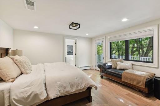 Retreat to the luxurious primary suite, complete with a private deck offering stunning views of the pondâyour serene escape awaits.