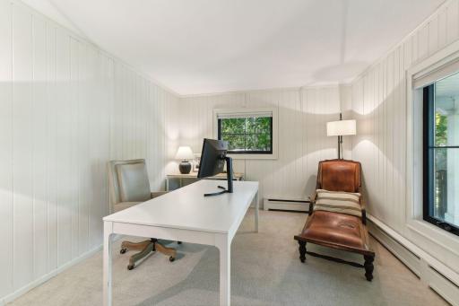 Versatile and inviting, this flex room features charming beadboard, making it the perfect space for your home office, playroom, or cozy reading nook.