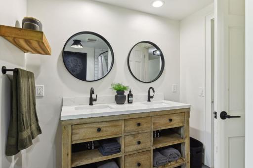 Experience timeless charm with a farm-style double sink vanity, adding character and convenience to your bathroom space.