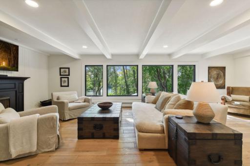 Experience the airy elegance of this open-concept floor plan with amazing nature views, illuminated by natural light beaming throughout.