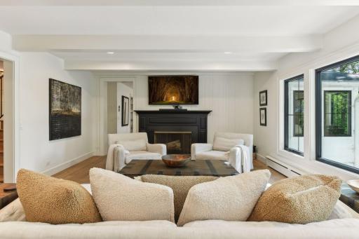 Cozy up in style with this stunning modern fireplace, the centerpiece of a sleek and inviting family room.