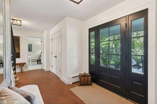 Very spacious foyer featuring a double door coat closetâperfect for storage.