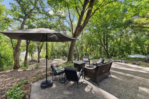 Embrace the tranquility of a wooded yard with stunning water views, creating a serene backdrop for your dream home.