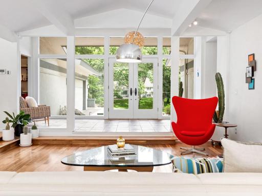 The expansive foyer opens up to the recessed formal living area.