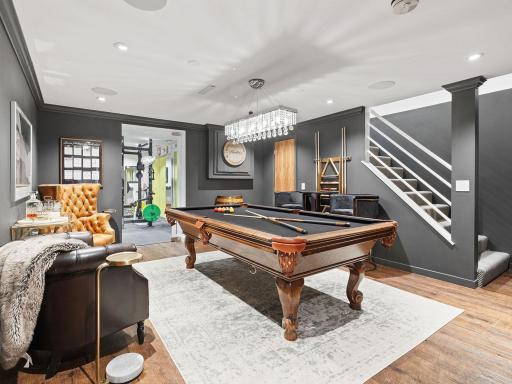 This beautifully remodeled basement seamlessly blends elegance with comfort.