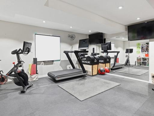 This spacious bonus room is currently a home gym!