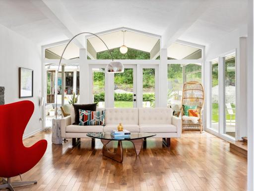 The floor to ceiling windows bathes the main living spaces in natural light, inviting the outside in!