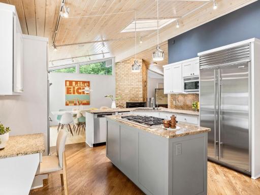 Mid-Century Modern open concept design emphasizes spaciousness and flow, seamlessly connecting living, dining, and kitchen areas while celebrating natural light.