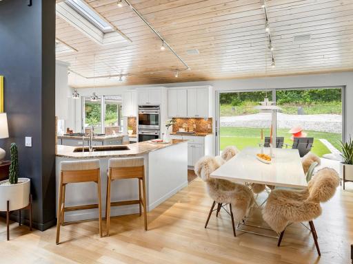 The custom doors leading to the back yard open fully for a true indoor/outdoor experience.
