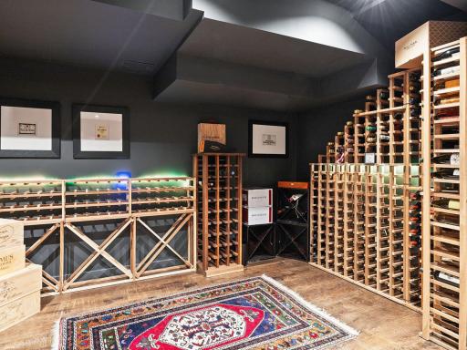 Custom wine area is easily converted to a wine room, with custom HVAC already installed - Just add doors!