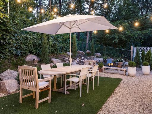 Welcome to the "grotto," an inviting informal dining area nestled on the side of the propertyâideal for cozy evenings by the fire.