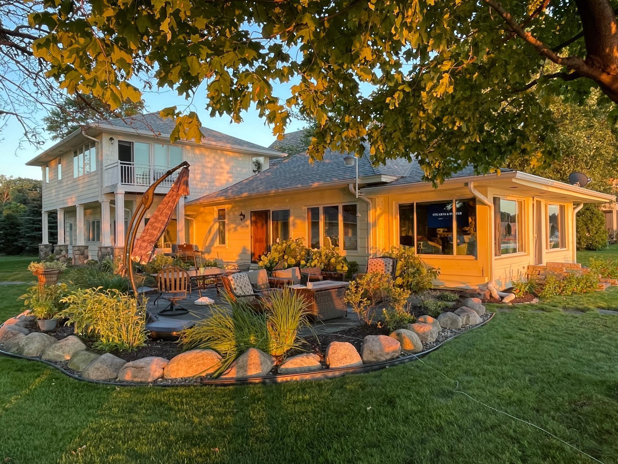 from grass looking at home with sun setting in backround.jpg