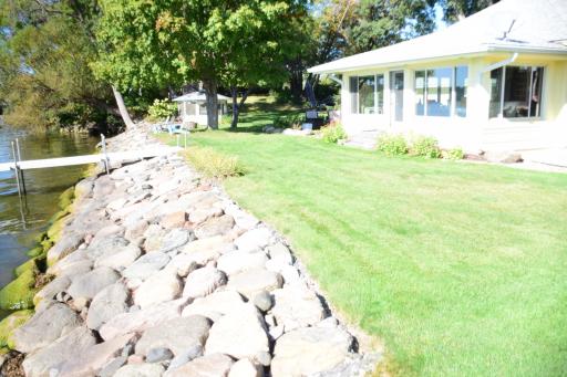 Beautifully done rip rap with boulders steps to lake