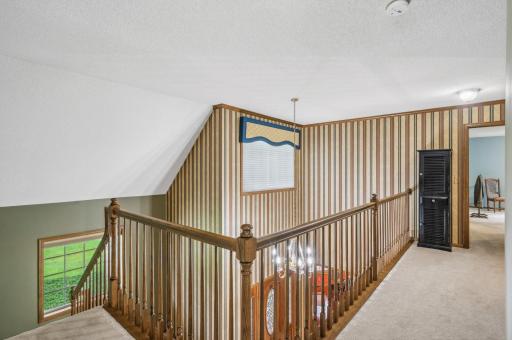 Staircase leads to a catwalk to the Primary Suite