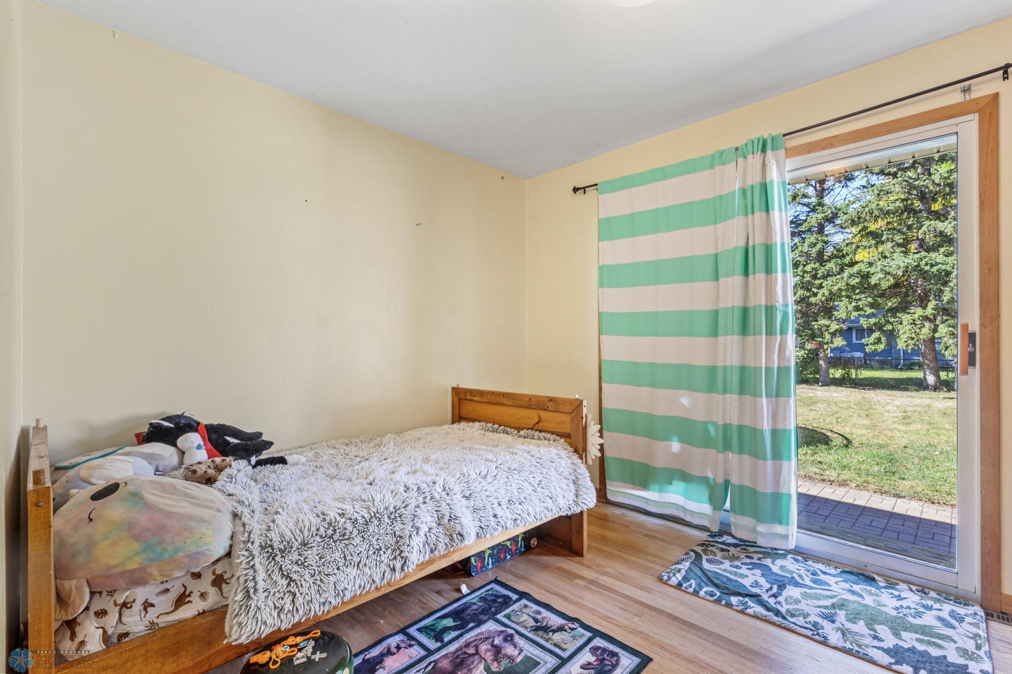 Bedroom with patio door to back yard