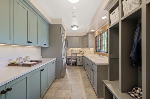 The main floor also features a mudroom as you enter from the garage with laundry that thoughtfully redefines convenience and ensures your everyday items will remain organized and clutter free.
