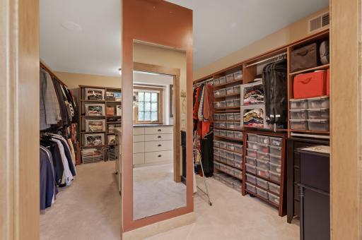 The primary suiteâs dressing room is a luxurious retreat, offering an expansive, organized space for all your wardrobe needs.