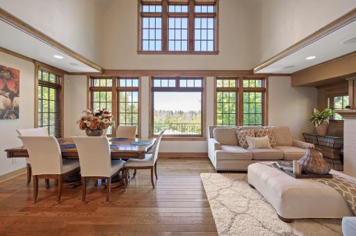This inviting living room and informal dining space, located just off the kitchen, create the perfect setting for everyday comfort and casual entertaining.