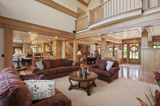 The great room seamlessly blends into an open floor plan, creating a spacious and fluid layout that connects the living, dining, and kitchen areas.