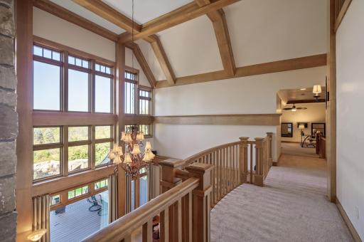 Large windows flood the entire upper level with natural light and provide stunning views.