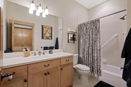 The en-suite bathroom includes a fully shower and tub combination and modern fixtures, offering both comfort and convenience.