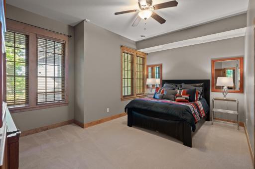 The second of 3 lower level bedrooms offers plenty of natural light, creating a cozy and inviting atmosphere.