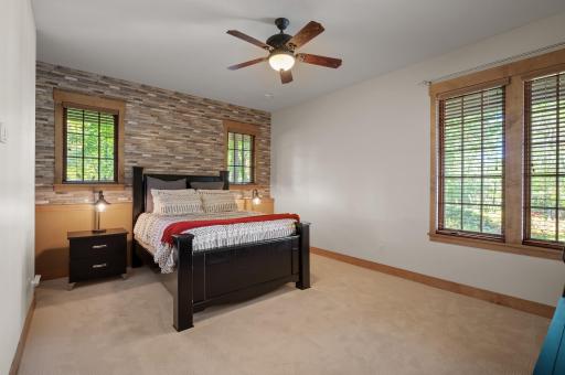 The third bedroom on the lower level is a cozy and versatile space, perfect for guests or family members.