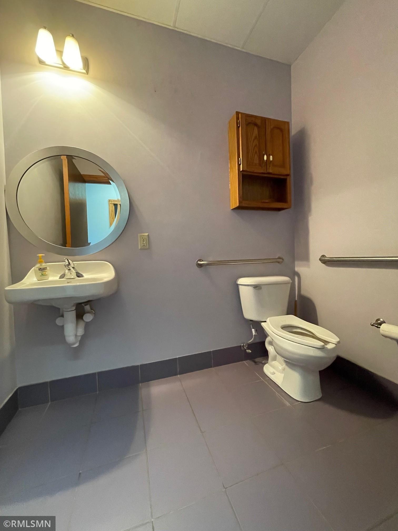 Bathroom features tile flooring.