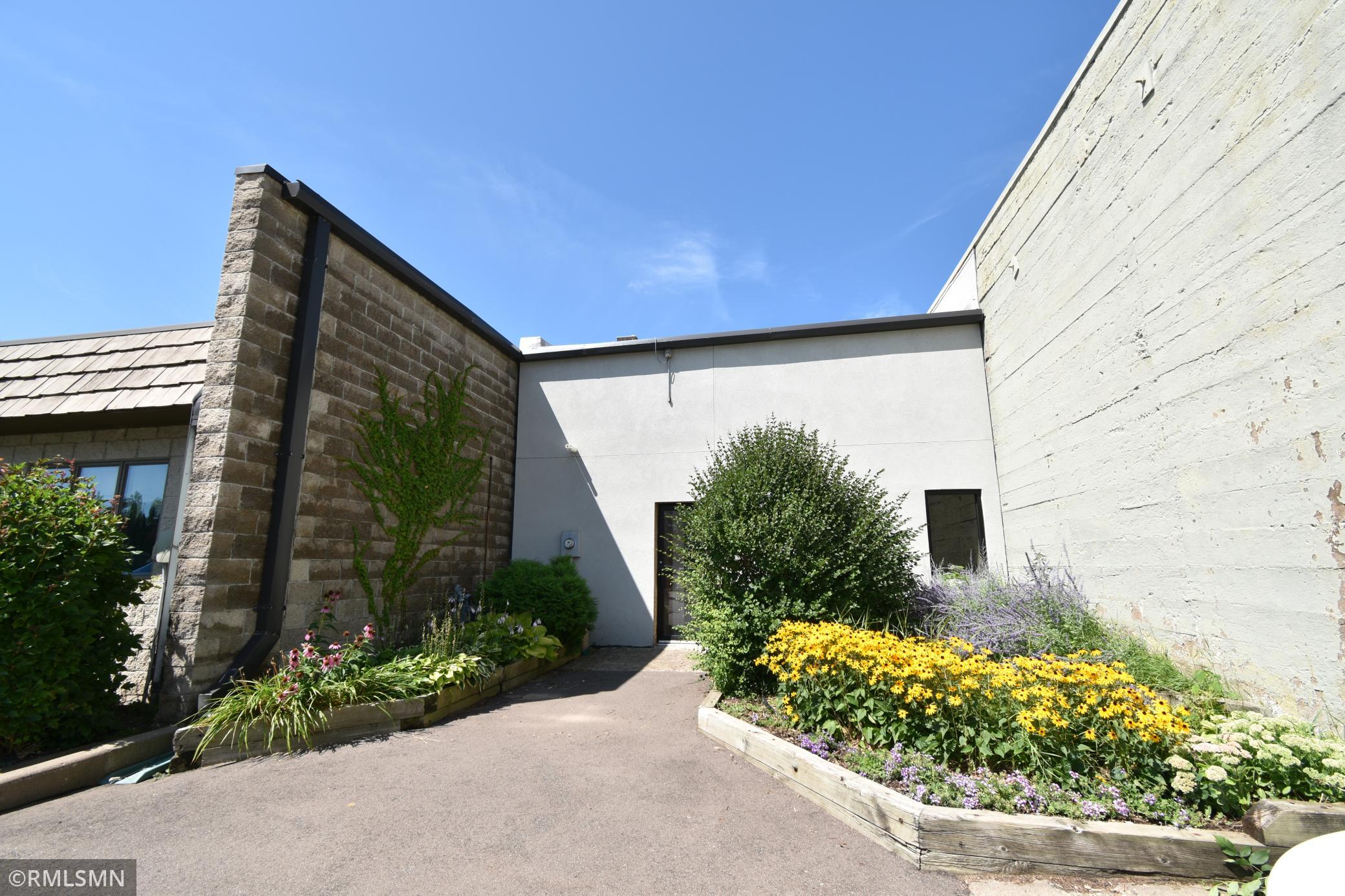 Tastefully landscaped back patio.