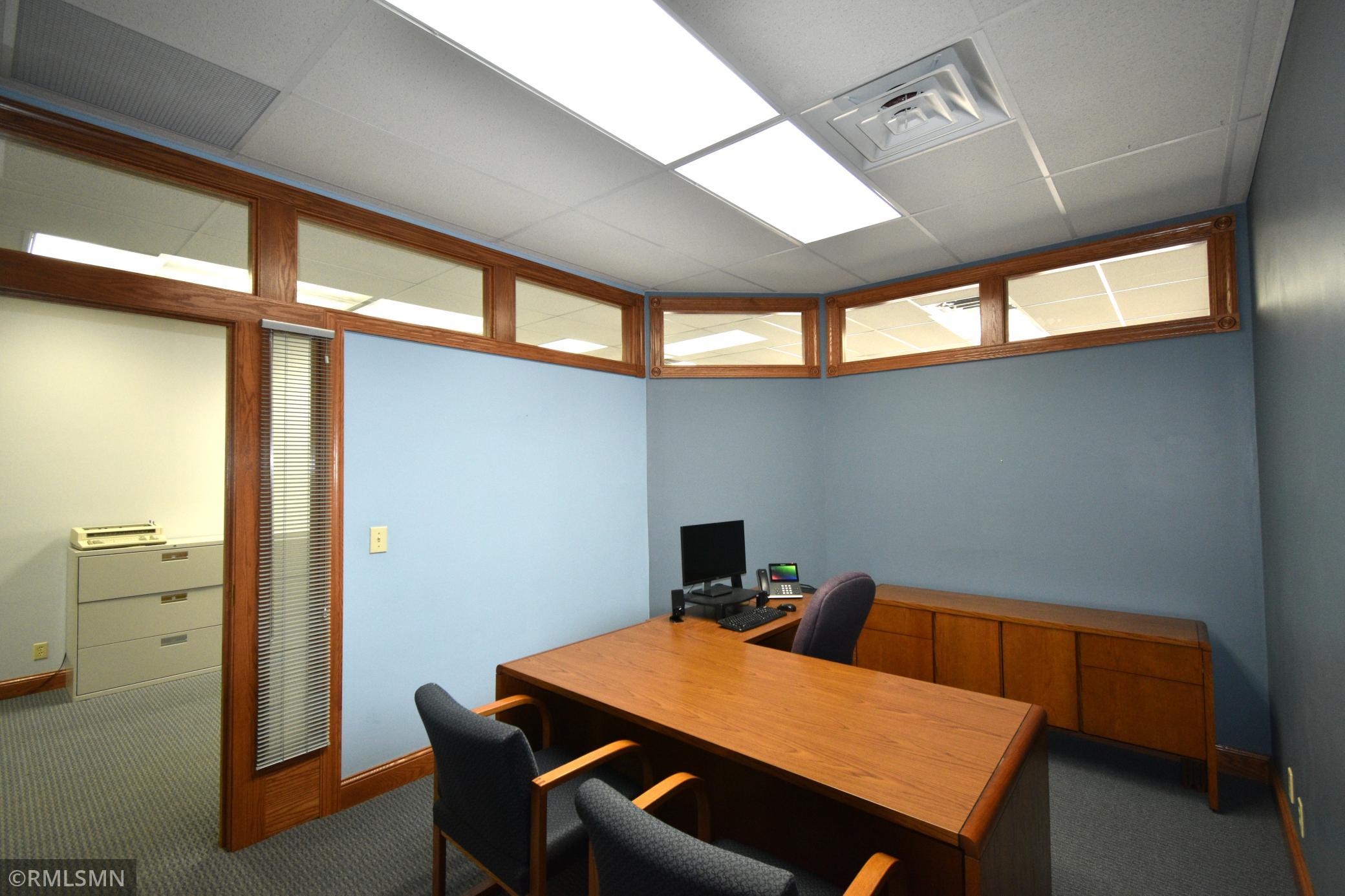 Natural lighting shining through windows in office